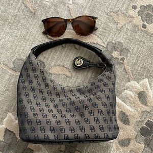 Dooney and Bourne small arm bag. Dark gray with black logo